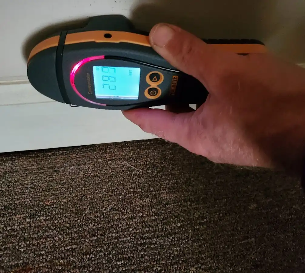Moisture detection at baseboard during Storm Damage Restoration in Vero Beach